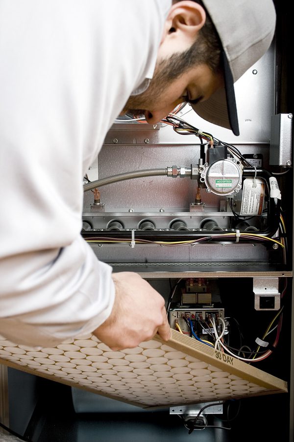 HVAC Technician fixing a unit.