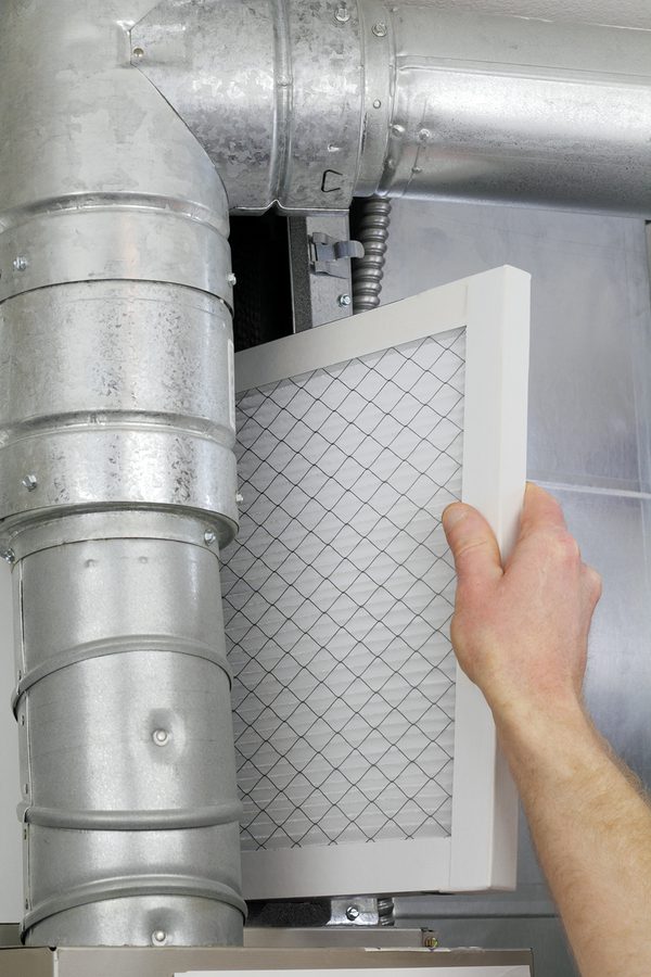 Replacing an AC filter.